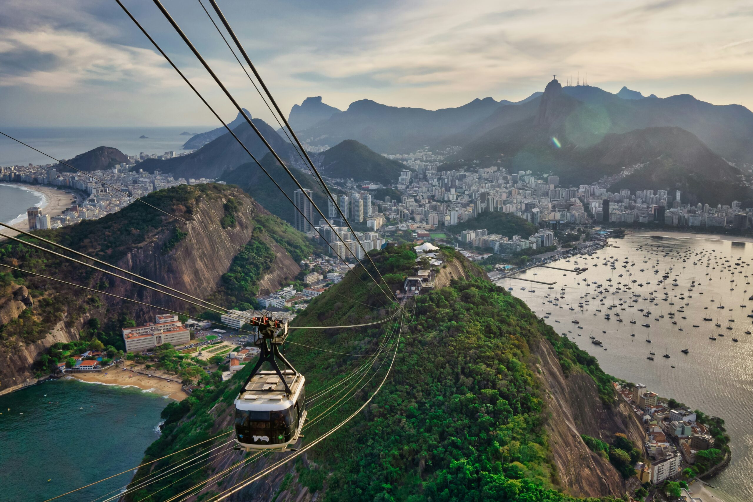 "A breathtaking view of Rio de Janeiro, Brazil, featuring the Christ the Redeemer statue, Sugarloaf Mountain, and the golden beaches of Copacabana."